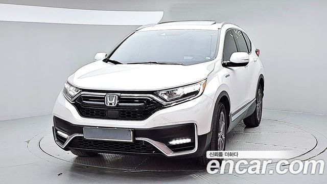 Honda CR-V 5-го поколения 2.0 Hybrid Touring 4WD - фото 0
