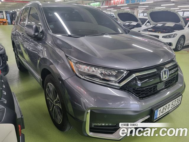 Honda CR-V 5-го поколения 2.0 Hybrid Touring 4WD - фото 2