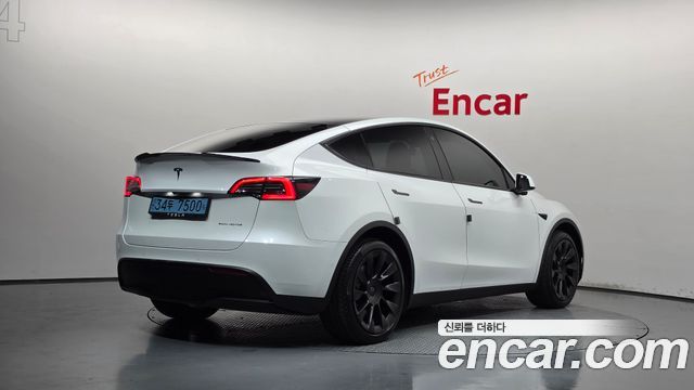 Tesla Model Y Long Range AWD - фото 1