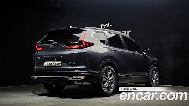 Honda CR-V 5-го поколения 2.0 Hybrid Touring 4WD - фото 1
