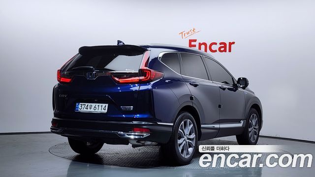 Honda CR-V 5-го поколения 2.0 Hybrid Touring 4WD - фото 1