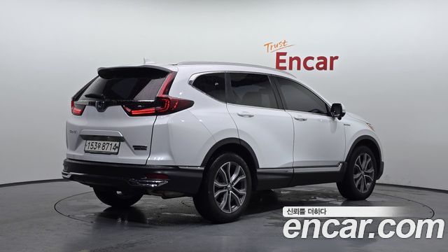 Honda CR-V 5-го поколения 2.0 Hybrid Touring 4WD - фото 1